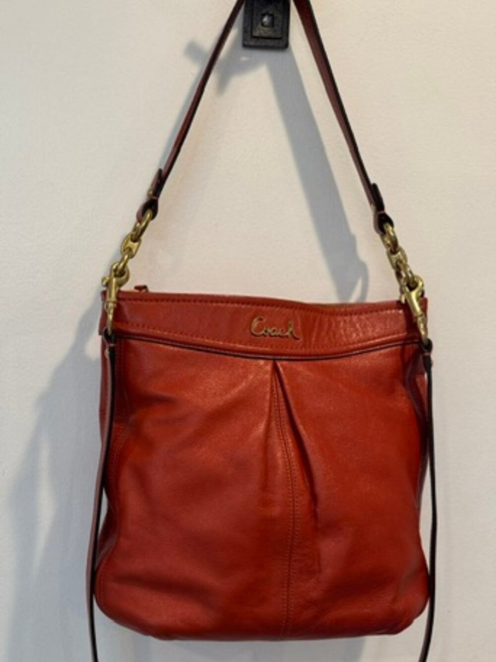 Classic orange leather Coach shoulder cross body bag. Excellent condition.